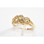 A 9CT GOLD DIAMOND DRESS RING, of knot design set with brilliant cut diamonds, with 9ct hallmark,
