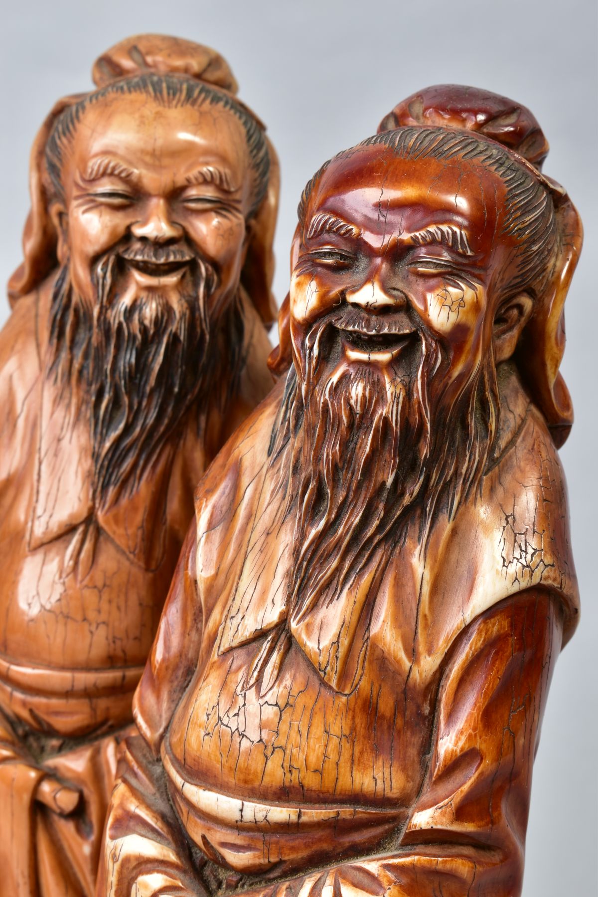 TWO NEAR IDENTICAL CHINESE CARVED AND BROWN STAINED IVORY FIGURES OF IMMORTALS, on oval bases with - Image 5 of 6