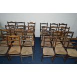 TWENTY FOUR RUSH SEATED LADDER BACK CHAIRS, all with matching/similar backs, some with losses and