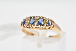 AN EARLY 20TH CENTURY GOLD, SAPPHIRE AND DIAMOND BOAT RING, set with four graduated oval sapphires