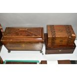 A MAHOGANY TEA CADDY OF SARCOPHAGUS FORM, twin compartments with glass mixing bowl, gilt ball and