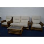 A MODERN CROSS RATTAN FOUR PIECE CONSERVATORY SUITE with oatmeal removable cushions, comprising a