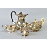 A GEORGE V SILVER FOUR PIECE TEA SERVICE, of oval form with a cast Celtic rim, tea pot with ivory