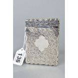 AN EDWARDIAN SILVER CARD CASE OF WAVY RECTANGULAR FORM, foliate engraved decoration, vacant