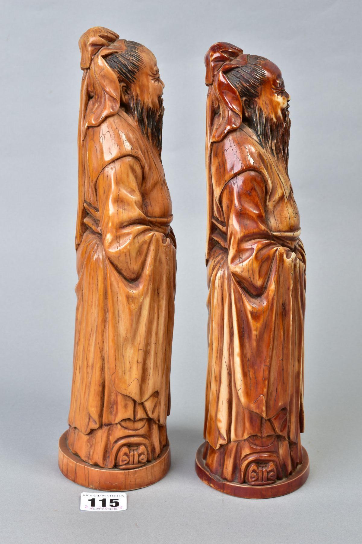 TWO NEAR IDENTICAL CHINESE CARVED AND BROWN STAINED IVORY FIGURES OF IMMORTALS, on oval bases with - Image 4 of 6