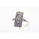 A PERIDOT AND AMETHYST DRESS RING, designed as a rectangular panel set with circular peridot and