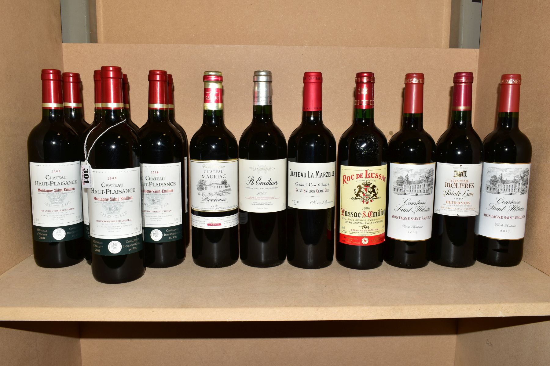 THIRTEEN BOTTLES OF BORDEAUX RED WINE AND ONE MINERVOIS, comprising seven bottles of Chateau Haut