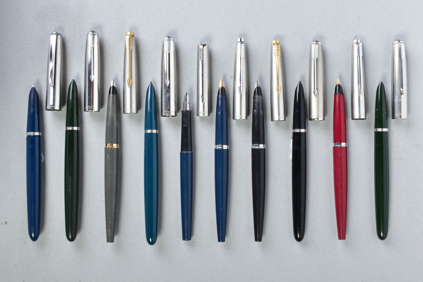 TEN PARKER FOUNTAIN PENS including a blue and chrome '21' with an unusual clip and nib, a blue and