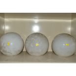 A SET OF FOUR OPAQUE WHITE GLASS SPHERICAL LIGHT SHADES WITH THREE NICKEL PLATED FITTINGS,