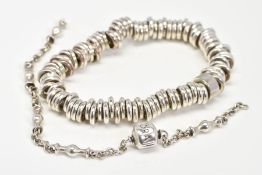 TWO BRACELETS, to include an elasticated silver plated metal bracelet and a belcher link chain