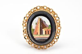 A MICRO MOSAIC PENDANT, the oval panel depicting a building, with curb link surround, length 32mm
