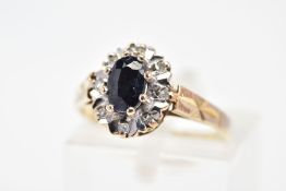 A 9CT GOLD SAPPHIRE AND DIAMOND RING, of cluster design set with a central oval sapphire and diamond