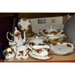 A ROYAL ALBERT OLD COUNTRY ROSES DINNER SERVICE, comprising sauce boat and stand, two bread and