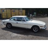 A 1973 TRUIMPH STAG 3.0 LITRE V8 AUTOMATIC CONVERTIBLE CAR WITH COUPE HARD TOP FINISHED IN WHITE,