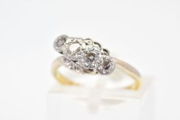 A FOUR STONE DIAMOND RING, of cross over design featuring a row of four diamonds, two brilliant cut,