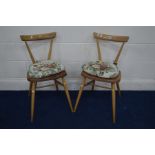 A PAIR OF ERCOL BLONDE ELM AND BEECH STACKING CHAIRS, with single bar back on cylindrical tapering