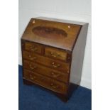 AN EDWARDIAN MAHOGANY AND BANDED BUREAU with five assorted drawers on bracket feet, width 76cm x