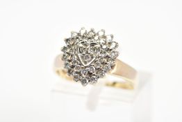 A 9CT GOLD HEART SHAPE DIAMOND CLUSTER RING, designed as a three tiered cluster in a heart shape