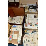 A LARGE COLLECTION OF FIRST DAY COVERS AND COMMERCIAL COVERS in three suitcases and a box,
