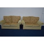 A MODERN FLORAL BEIGE UPHOLSTERED TWO PIECE LOUNGE SUITE comprising of two two seater settee's,