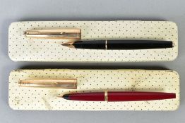 TWO PARKER FOUNTAIN PENS IN BOXES consisting of a French 45 in burgundy with a gold coloured cap