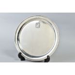 A GEORGE V SILVER CIRCULAR TRAY, bears applied crest style motif, makers James Dixon & Sons Ltd,