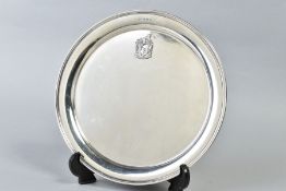 A GEORGE V SILVER CIRCULAR TRAY, bears applied crest style motif, makers James Dixon & Sons Ltd,