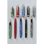 FIVE CONWAY STEWART FOUNTAIN PENS including a No 85L in gold vein marbled blue with a 14ct No 3 nib,