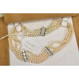 A FOUR ROW CULTURED PEARL CHOKER NECKLACE WITH DIAMONDS, designed as four rows of spherical cultured