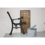 A PAIR OF MODERN CAST IRON BENCH ENDS, a modern galvanised mop bucket and a vintage printers block