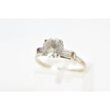 A GEM RING, designed as a central circular gem assessed as white sapphire in a raised four claw