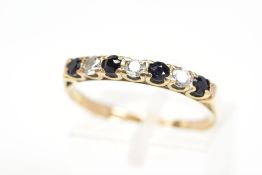A 9CT GOLD SAPPHIRE AND CUBIC ZIRCONIA RING, designed as a line of four circular sapphires