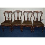 A SET OF FOUR LATE VICTORIAN MAHOGANY DINING CHAIRS, decorated splat back, on turned legs (sd)