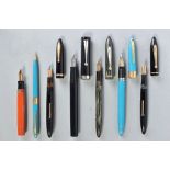 A BOXED WITH TAGS SHEAFFER VALIANT SNORKEL FOUNTAIN AND PENCIL SET in turquoise and gold trim, a