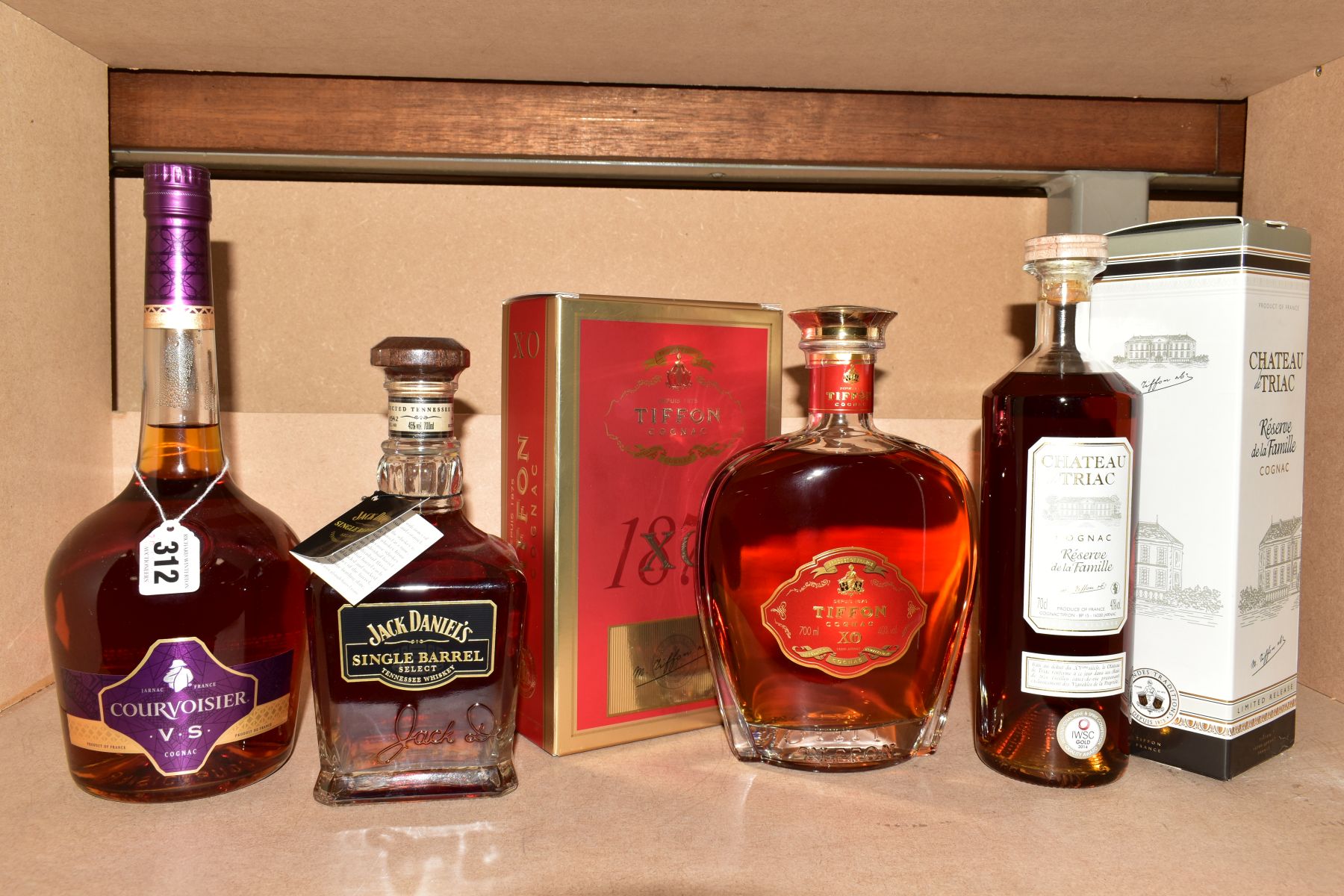 THREE BOTTLES OF COGNAC AND A BOTTLE OF WHISKEY, comprising a bottle of Courvoisier VS Cognac, 40%