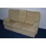 A BEIGE UPHOLSTERED THREE SEATER SETTEE, width 192cm