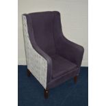 A MODERN PURPLE UPHOLSTERED WINGED ARM CHAIR, on square tapered legs, to the reverse back and