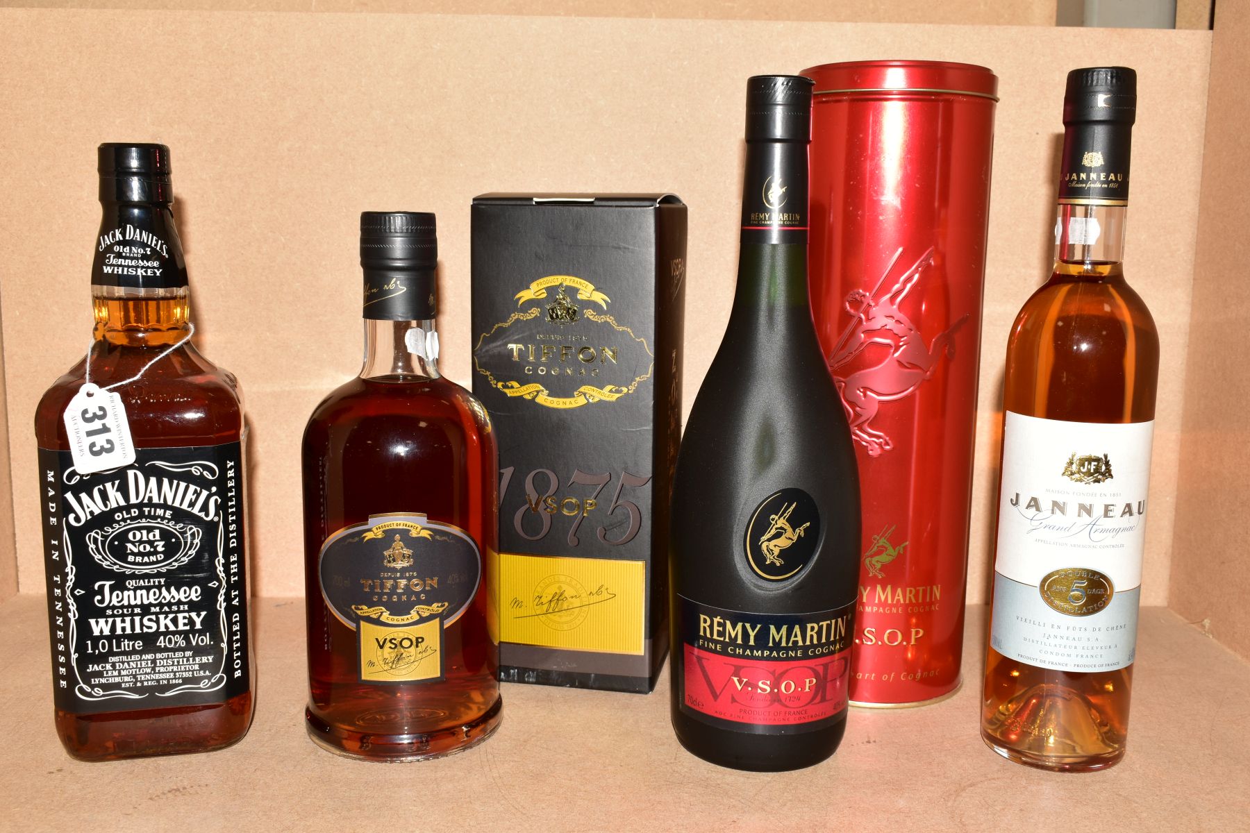 THREE BOTTLES OF COGNAC AND A BOTTLE OF WHISKEY, comprising a bottle of Remy Martin VSOP Fine