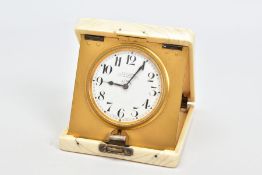 AN EARLY 20TH CENTURY IVORY CASED TRAVEL CLOCK, of square design with applied silver monogram to