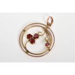 AN EARLY 20TH CENTURY GARNET AND SPLIT PEARL PENDANT, of circular open work design featuring