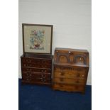 A LATE 20TH CENTURY OAK BUREAU with four drawers, a narrow modern mahogany chest of six drawers