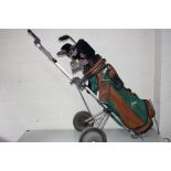 A GOLF BAG, TROLLEY AND EIGHTEEN CLUBS including Calloway, Pinseeker, Kunnan, Cobra etc