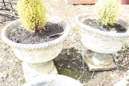 A PAIR OF MODERN COMPOSITE TWO PIECE GARDEN PLANTERS with rope edge and foliate detail with small
