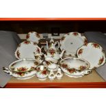 A ROYAL ALBERT OLD COUNTRY ROSES DINNER SERVICE, comprising two tureens and a tea pot, a coffee pot,