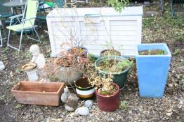 SEVEN GLAZED GARDEN PLANTERS, an oblong garden planter, four garden figures and a plastic storage