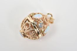 A 9CT GOLD BALL PENDANT, of open work rope twist design set with stones assessed as opals and