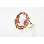 A 9CT GOLD CAMEO RING, of oval design depicting a lady in profile, within a rope twist surround,