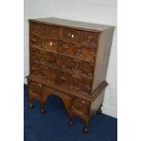 A LATE 19TH/EARLY 20TH CENTURY OAK CHEST ON STAND of eight assorted geometric fronted drawers,