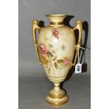 A ROYAL WORCESTER TWIN HANDLED VASE, painted floral detail on blush ivory ground with gilt