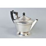 A GEORGE VI SILVER CIRCULAR TEAPOT, black bakelite fitments, makers A.L. Davenport Ltd, Birmingham